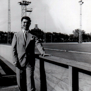 Don Yick Chin stands next to Titan Field in the 1950s.