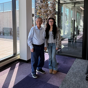 Don Yick Chin stands next to his scholarship recipient, Mimi.