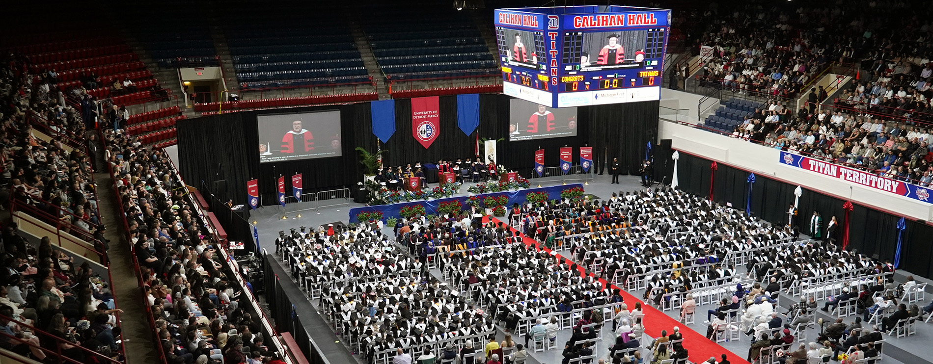 Hundreds of people inside of Calihan Hall during a Commencement ceremony.