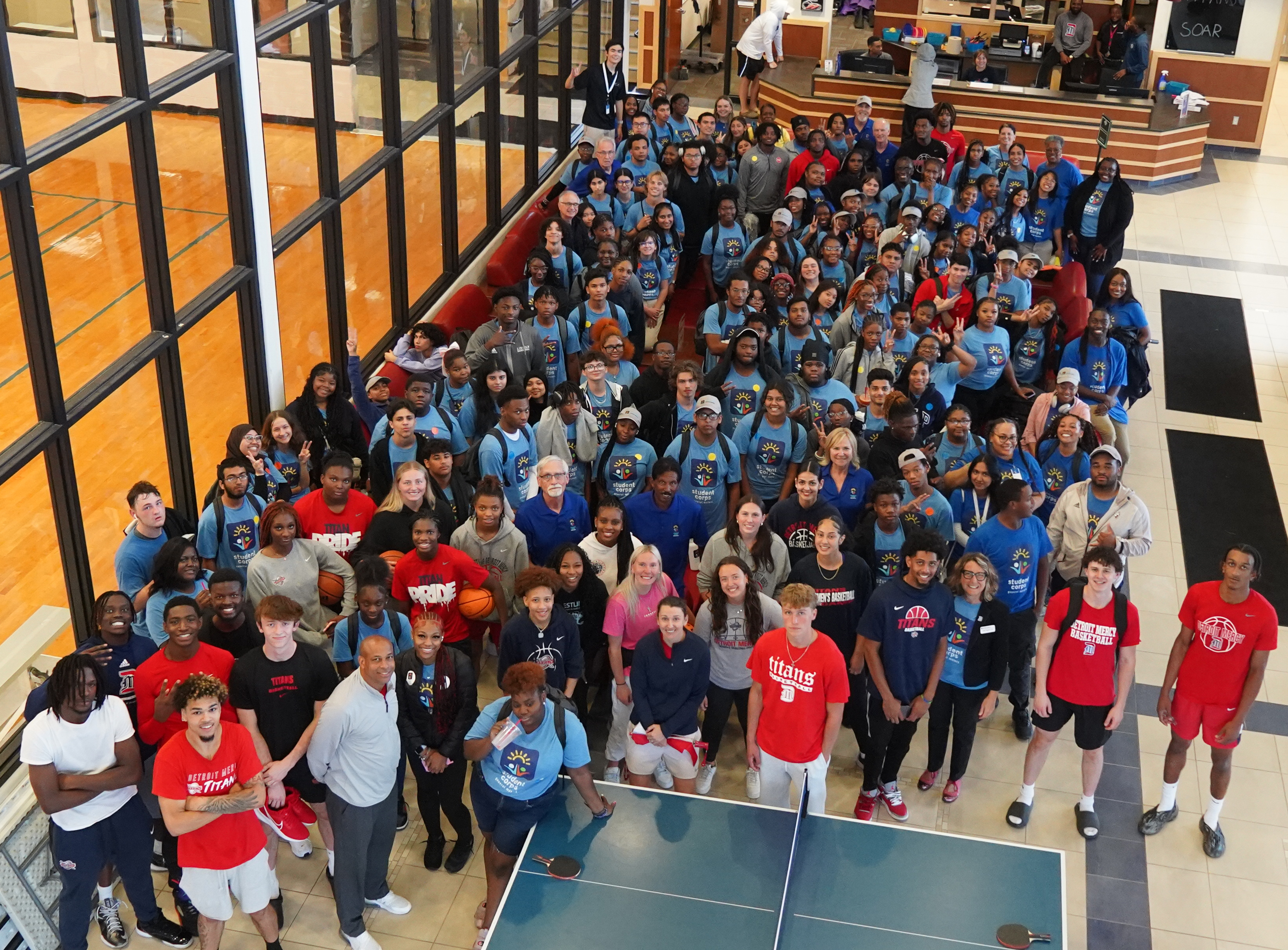 Dozens of students and others stand inside of the Student Fitness Center.