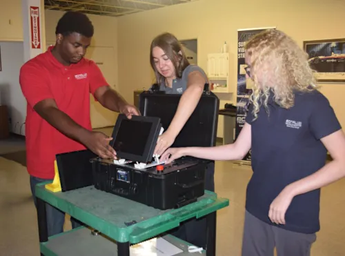 Students work on a portable prototype case
