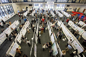 An overhead shot of a UDM research symposium