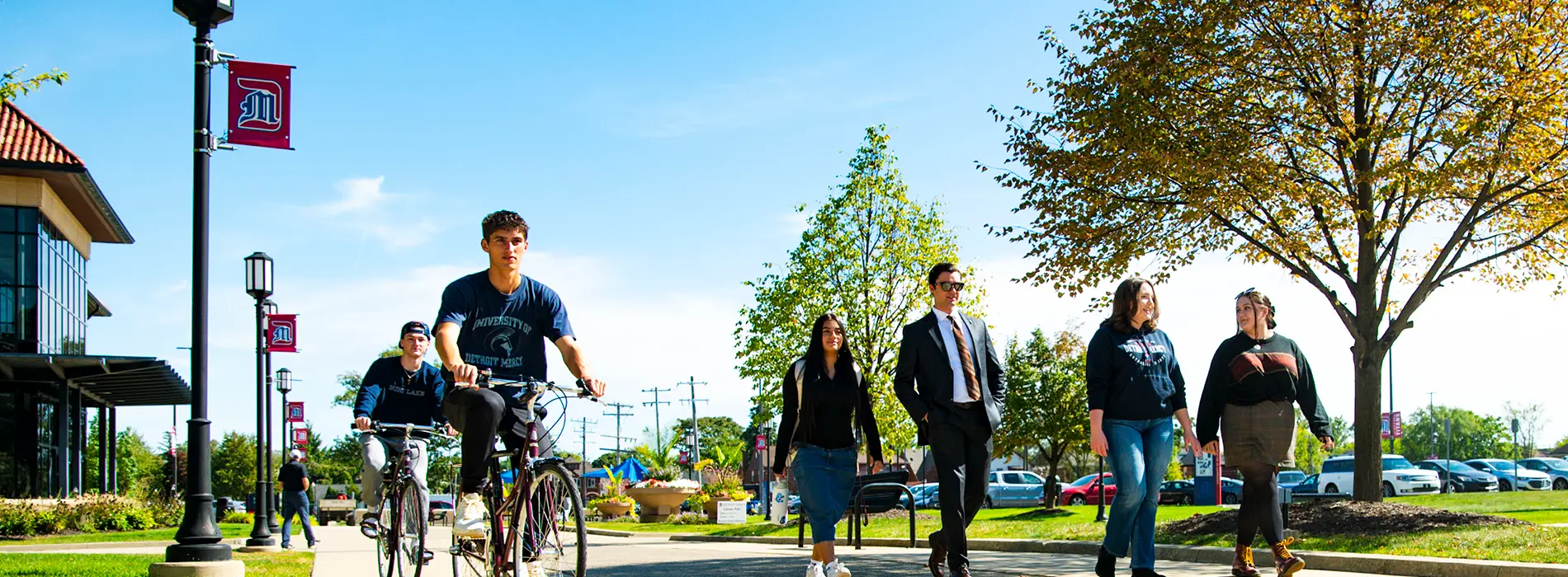 students outside walking and biking