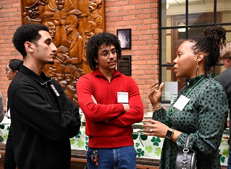 three adults having a conversation
