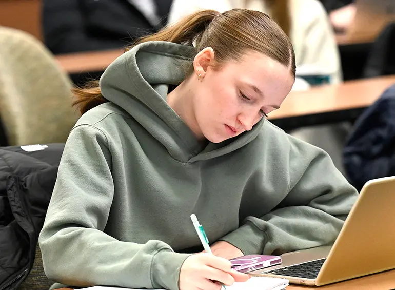 female student on a laptop