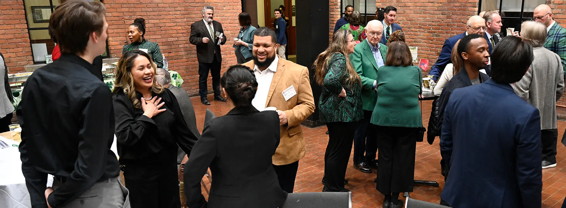 a gathering in the law school of alumni and students