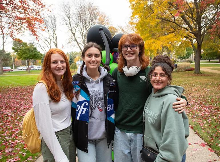 group of students smiling for the camera during fall's safety street event