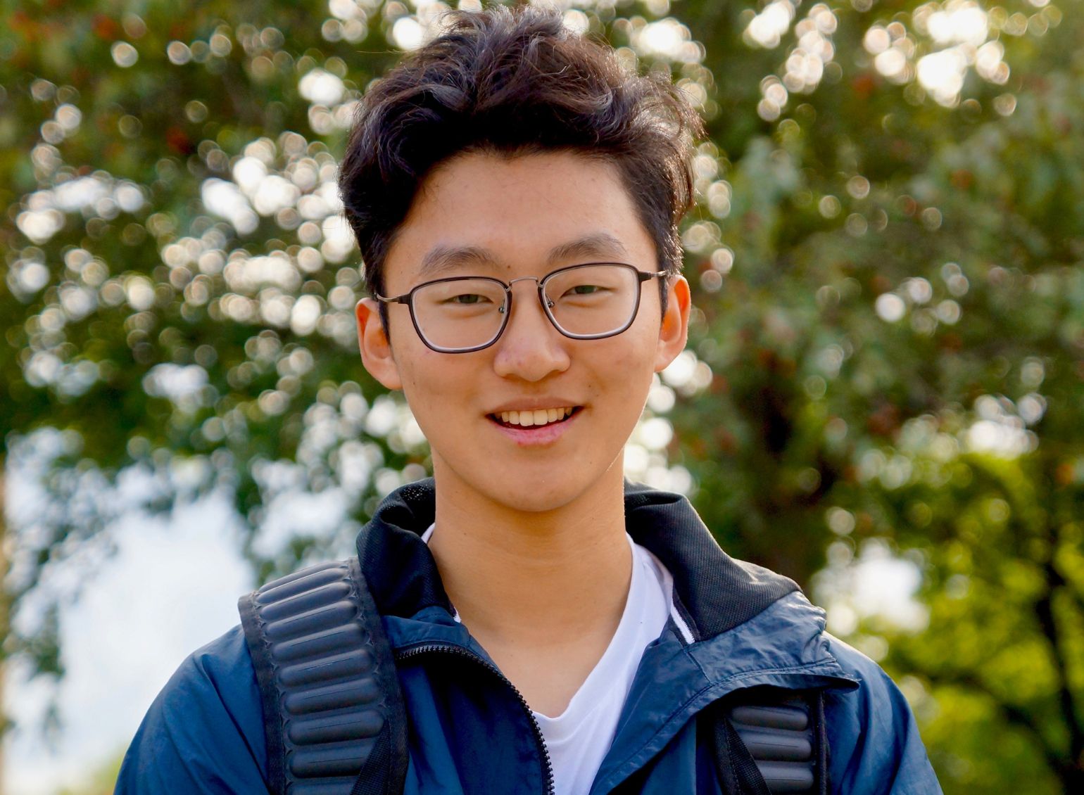 An international student smiles.