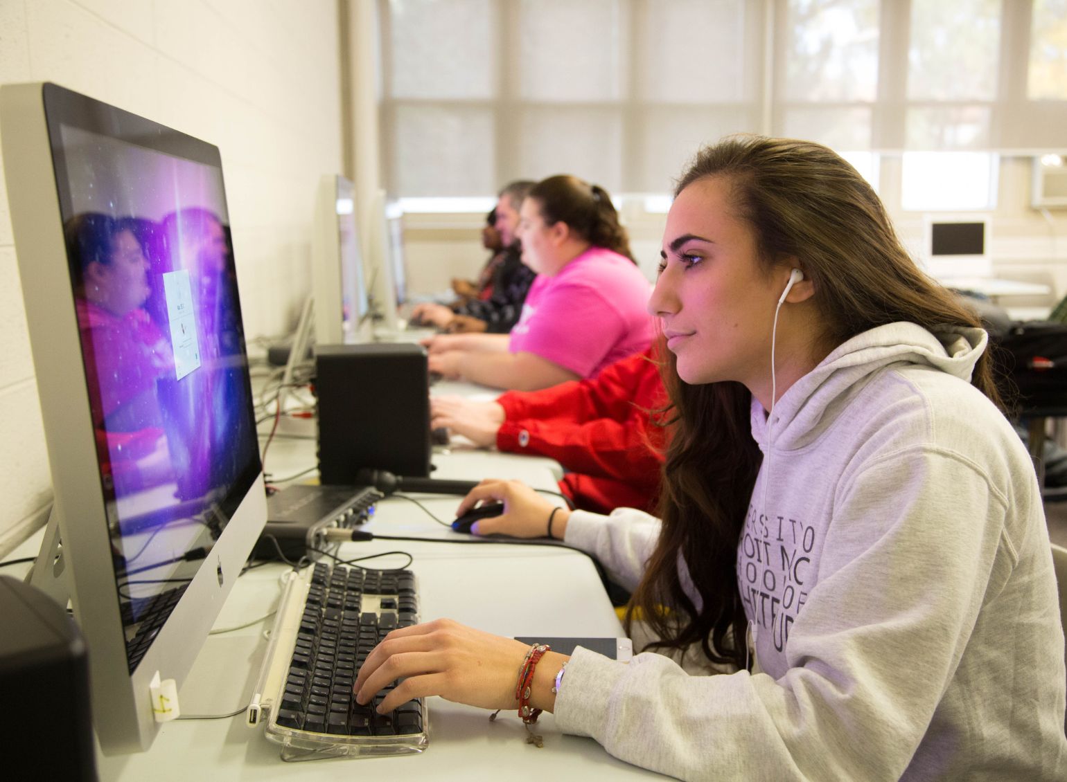 A student completes work on a computer.