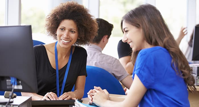 financial aid counselor talks to student