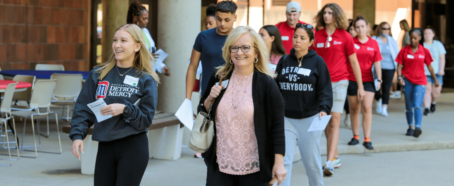 Students and parents walk across campus during SOAR.