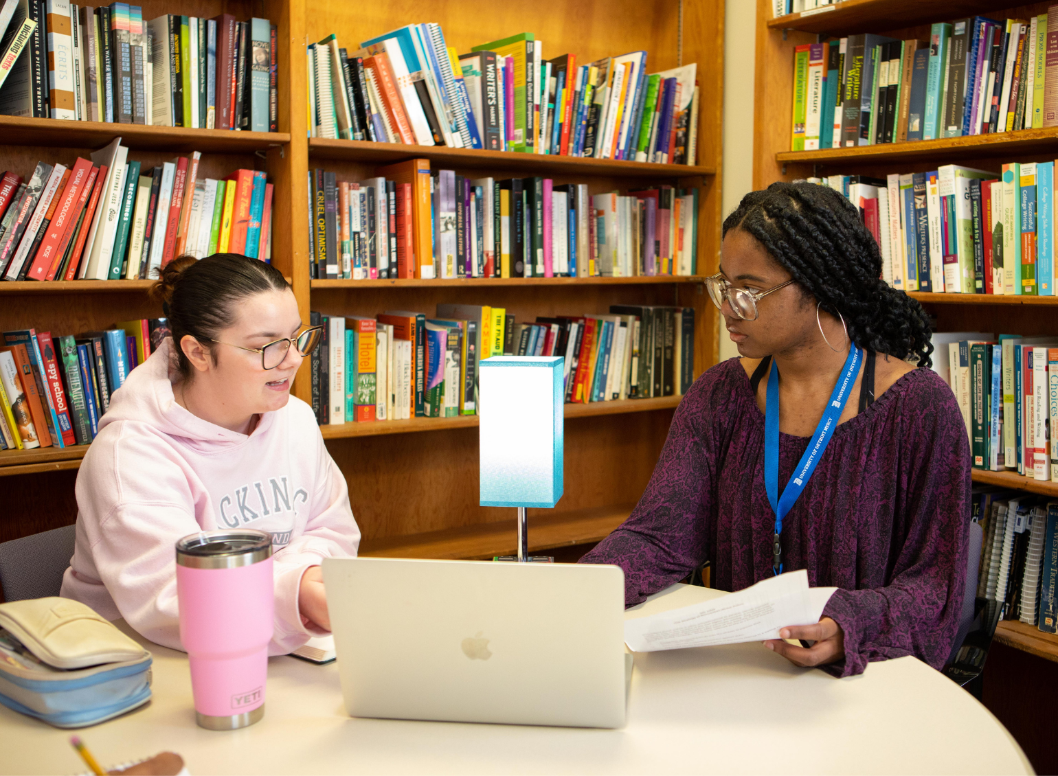 Two students work on an assignment at the Writing Center.