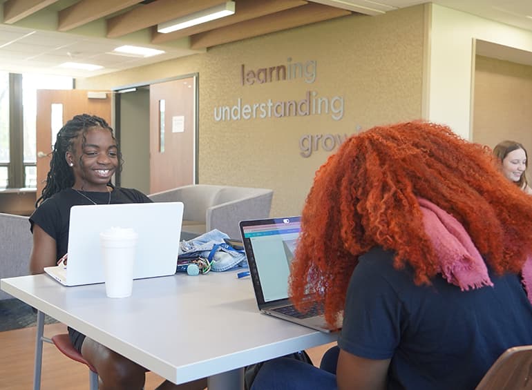 two female students in shiple lobby