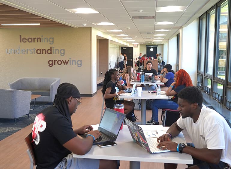 many students studying and chatting in shiple lobby