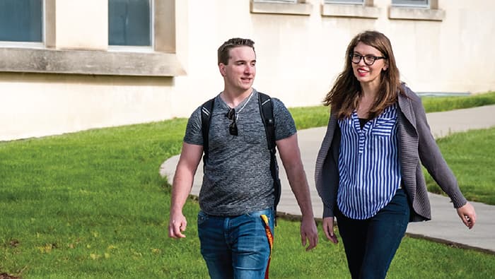 two students walking on campus