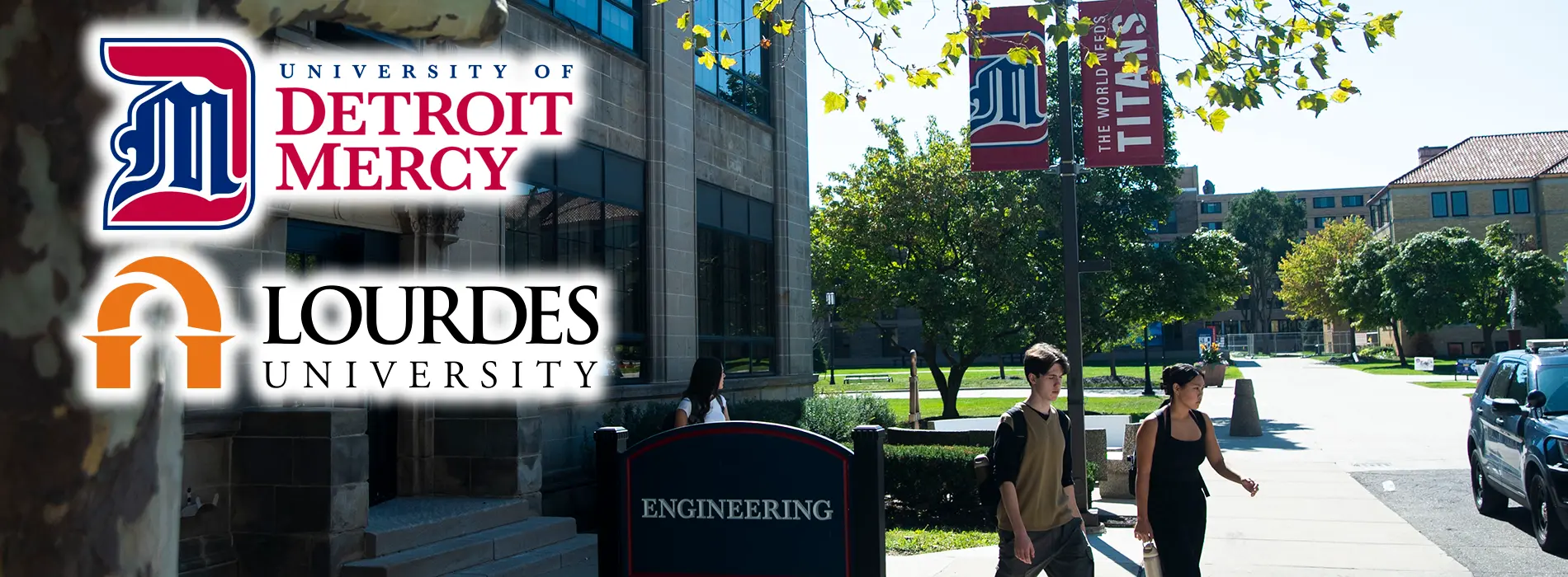 An aerial view shows Detroit Mercy's McNichols campus with Lourdes and UDM logos