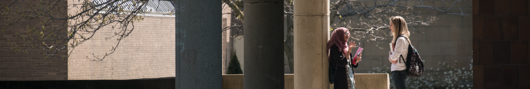 two female students outside talking