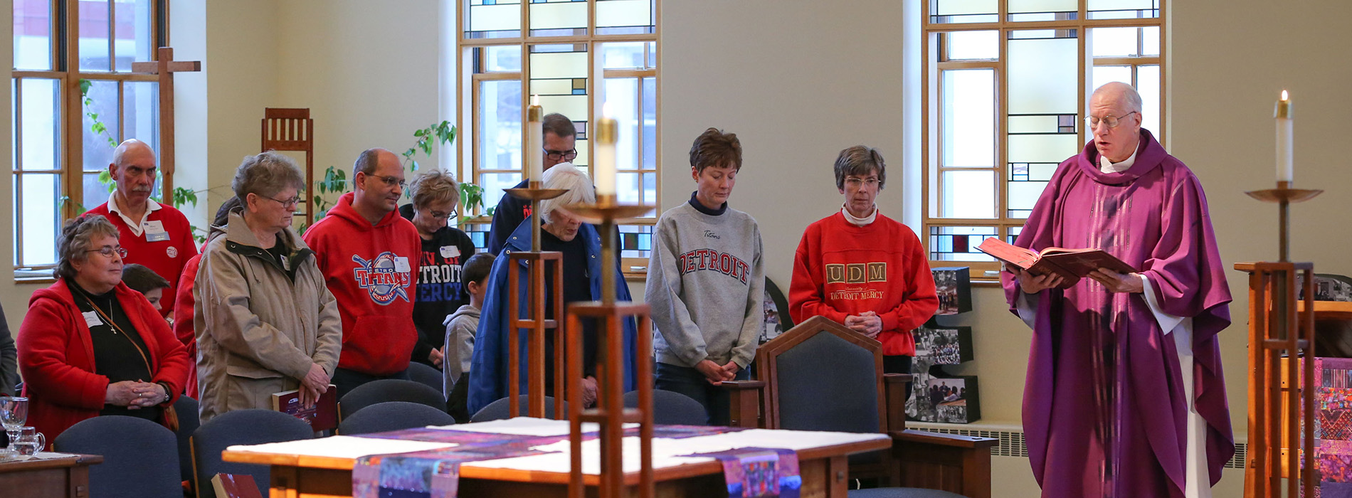Students and priest in St. Ignatius Chapel during a Mass