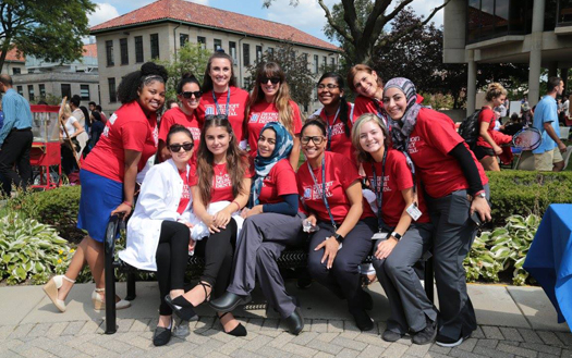 The Pre-Med Club on campus posing at the Student Organization Fair