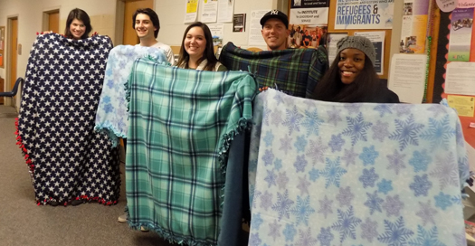 As the service component of the Michigan Geography Class, Detroit Mercy students (from left to right) Mary Warr, Antony Nedanovski, Faith Abrahamian, Charles Murphy and Kiana Williams made felt tie blankets to give to patients currently undergoing chemotherapy treatments.