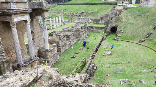 Students scan the ruins in Volterra, Italy
