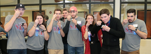 Students chowing down on some chili at the Alumni Chili Cook-off