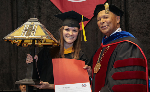 Sarah Cromwell, winner of a 2017 Mission Leadership Award, with President Antoine M. Garibaldi