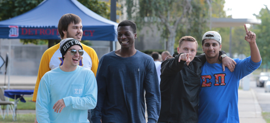 Students laughing as they walk through Homecoming 2017