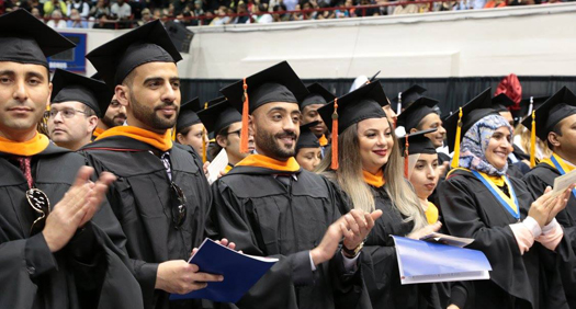 Photo of crowd of 2017 graduates at McNichols Commencement last year