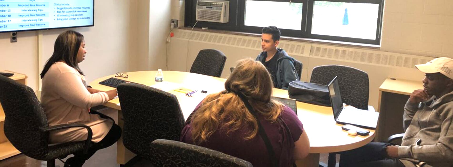 student talking to company at career fair