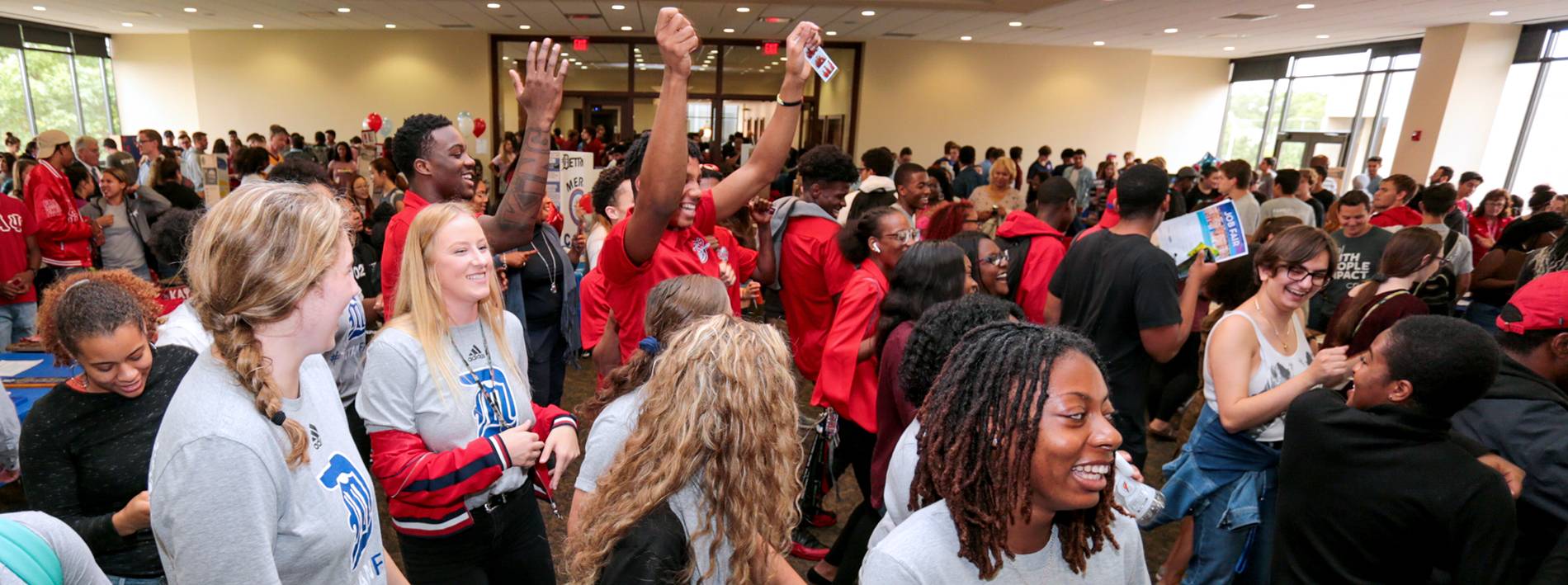 Students celebrating at the Student Org Fair