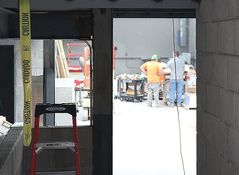 construction workers inside what will be the engineering annex