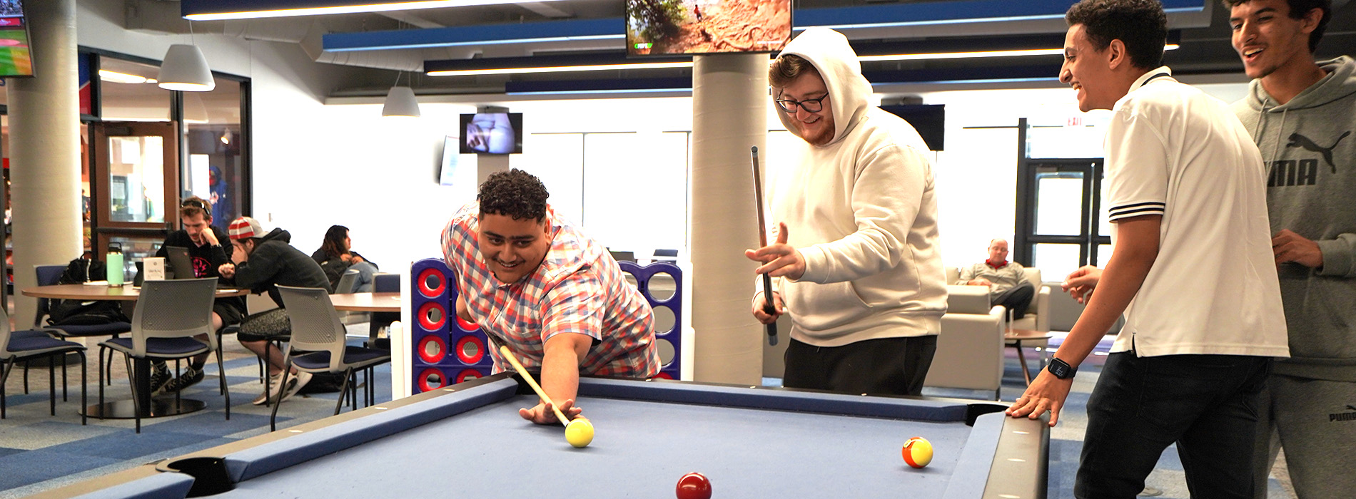 students playing pool in the student unions