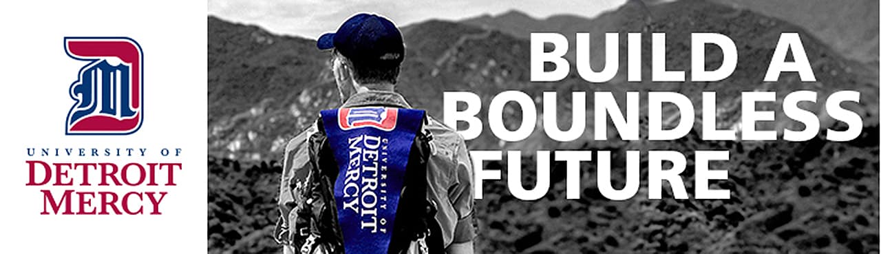 Student with Detroit Mercy Backpack gazing from the top of a mountain - Build a boundless future
