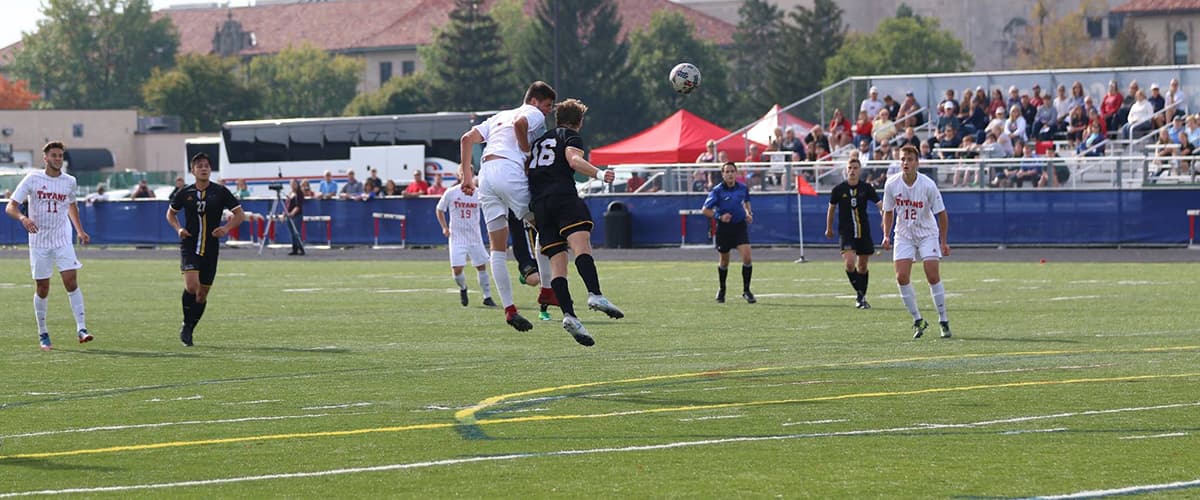 mens soccer team playing on titan field