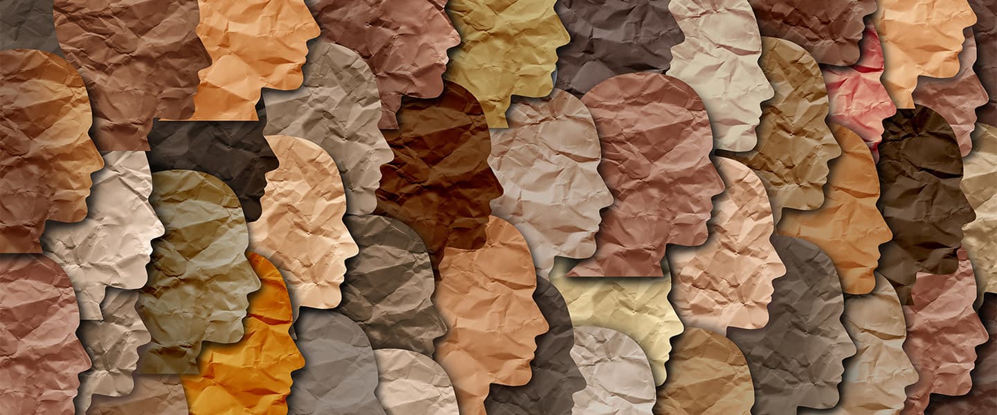 paper cutouts of faces in multiple colors