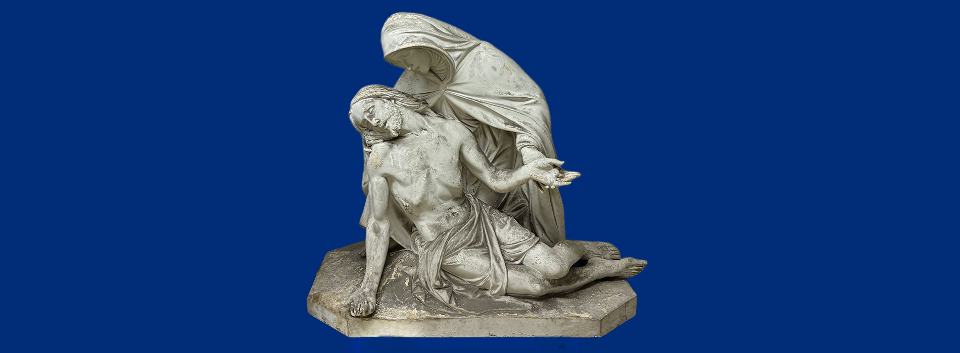 Pieta statue on blue background color