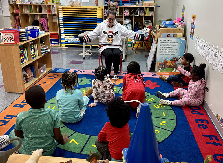 children in classroom being read to