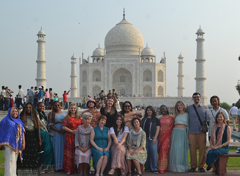 group photos of students in front of a temple