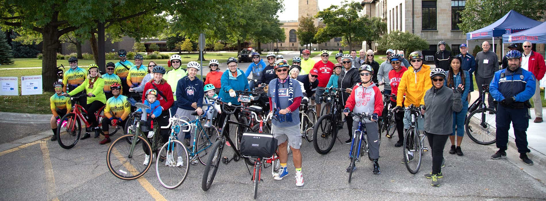 Big group of UDM alumni, students and friends getting ready for Detroit bike tour