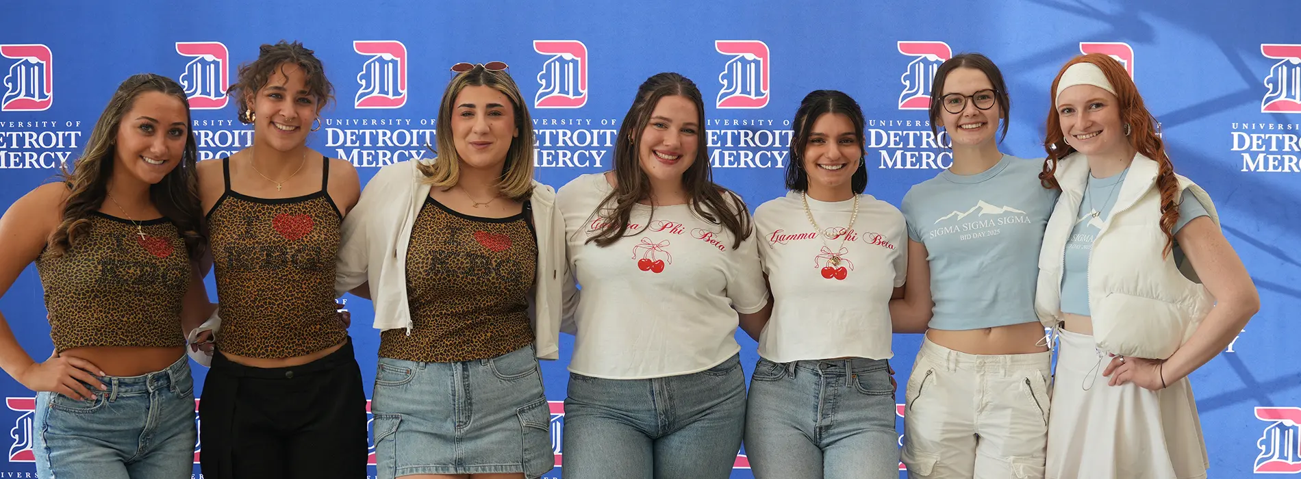 sorority and fraternity students posing for a photo.