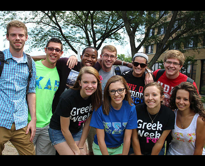smiling students, some wearing greek week tshirts