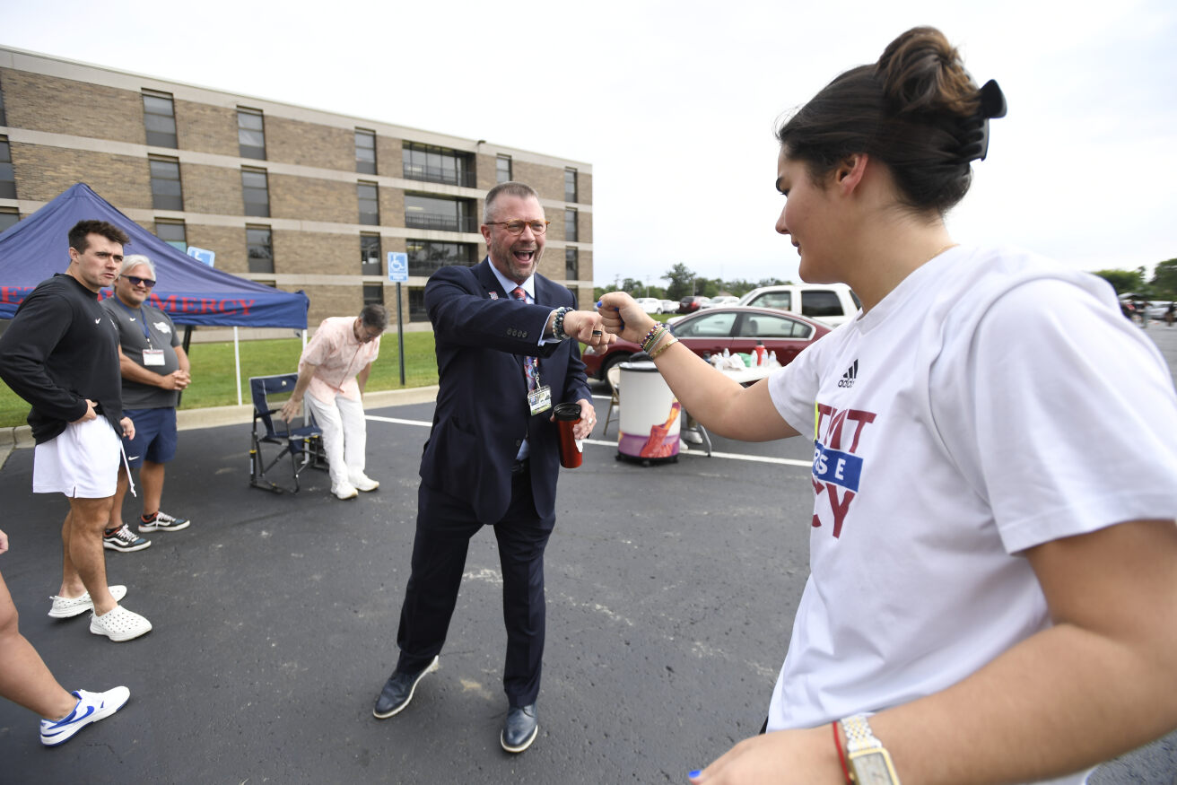 Dr. Taylor and student on move-in day