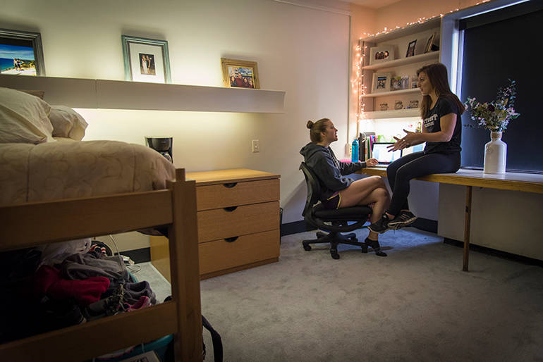 Students in a dorm room.