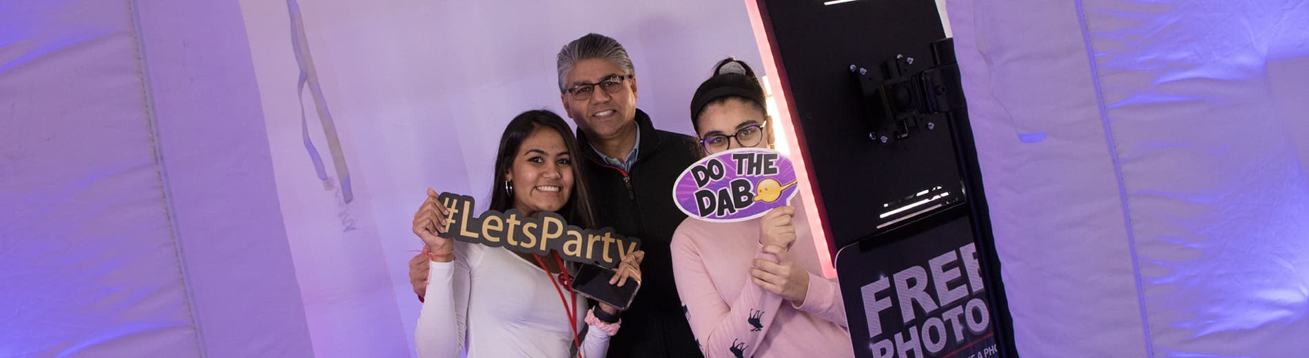 Two students with their parent
