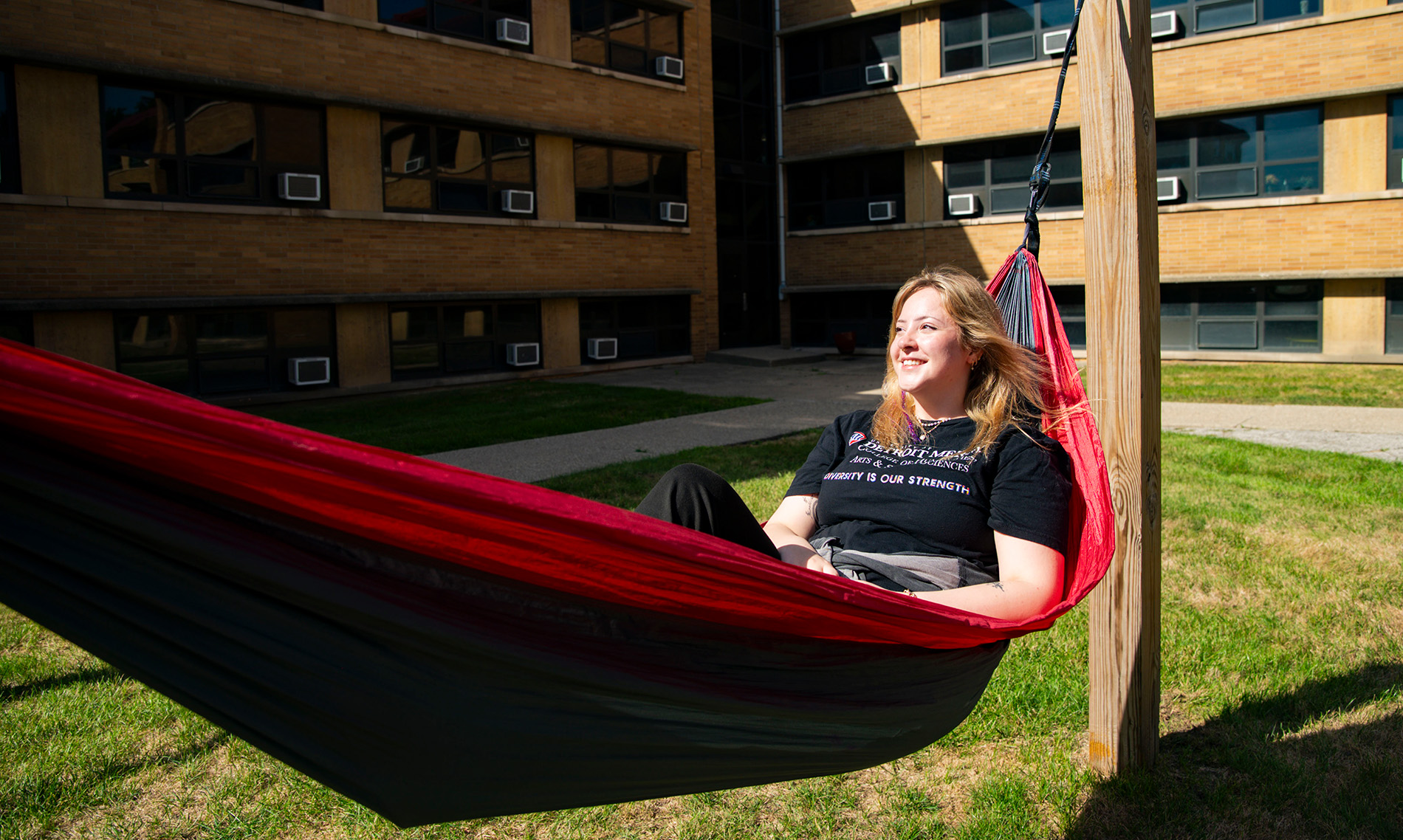 A student laying on a hammock