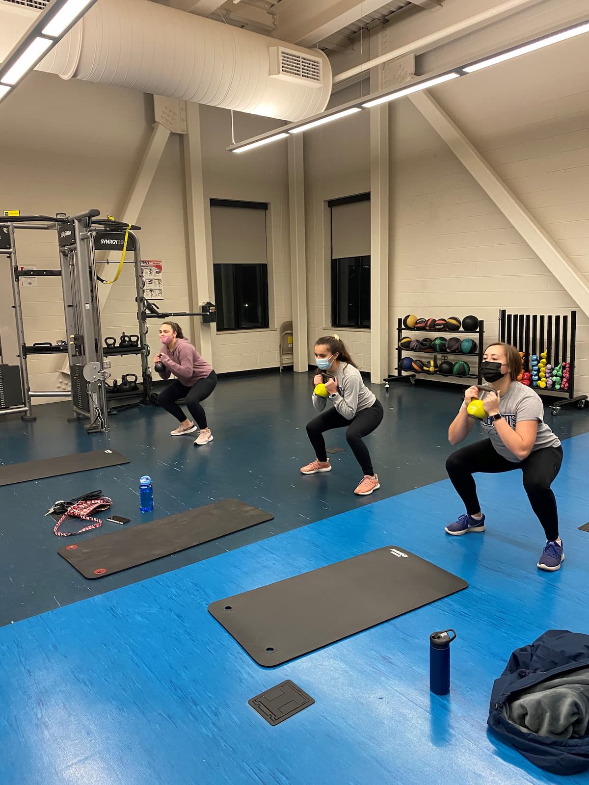 People exercising while wearing masks