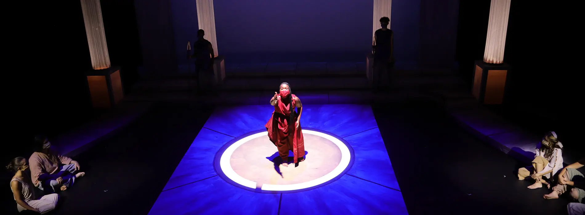 Detroit Mercy theatre major without stretched arms on stage from the play Antigone