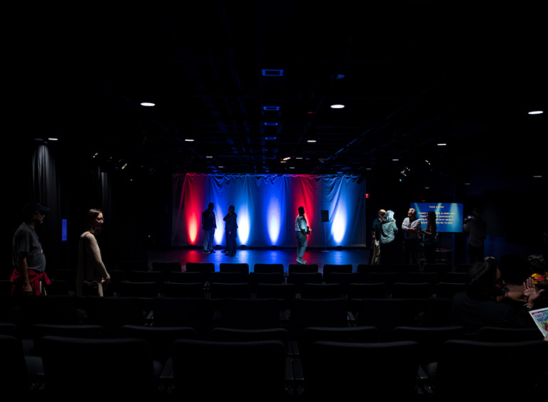 People tour the Black Box Theatre during its ribbon cutting..