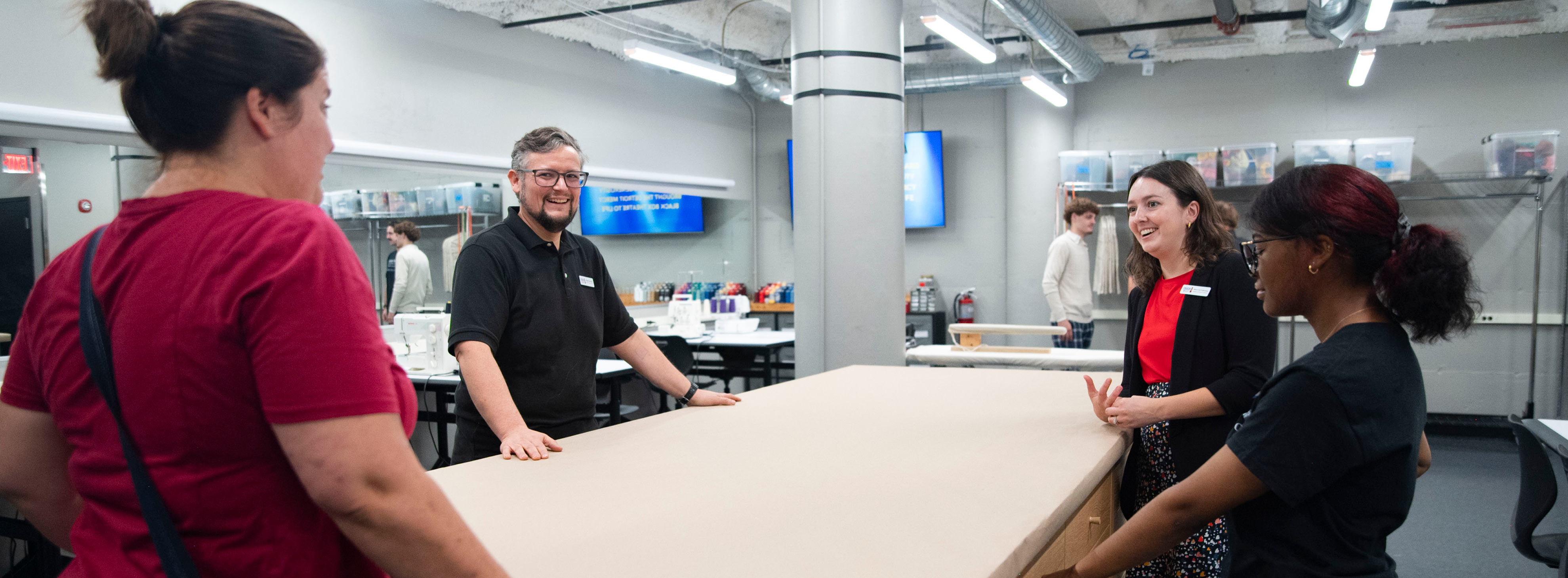 4 people in the theatre's costume shop